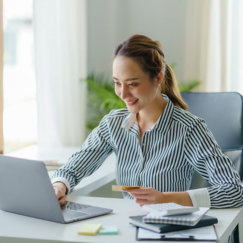 asian-businesswoman-using-laptop-to-check-balance-and-online-shopping-enjoy-online-shopping.jpg