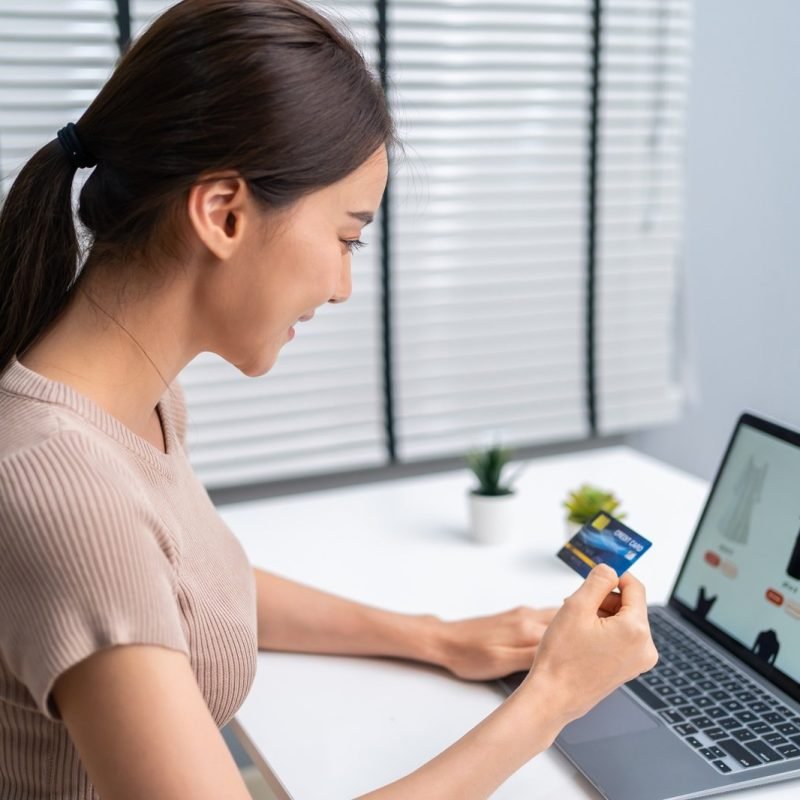 asian-young-woman-use-laptop-computer-for-shopping-product-sell-online-.jpg